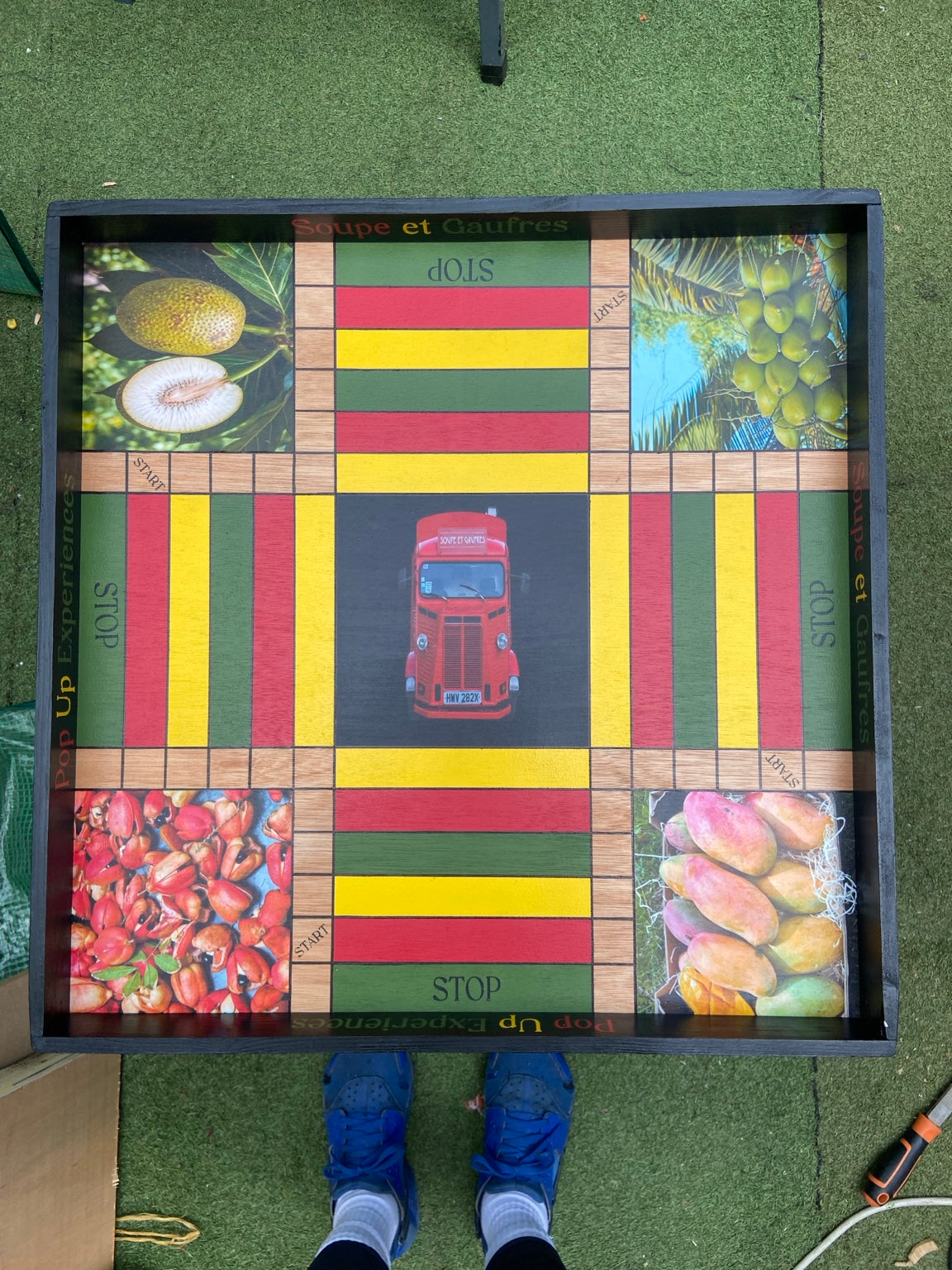 Overhead view of custom photo Ludi board